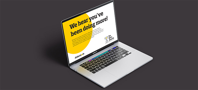 Mobile Image of a laptop displaying images of an employer branding rewards and recognition case study, with a black colour background.